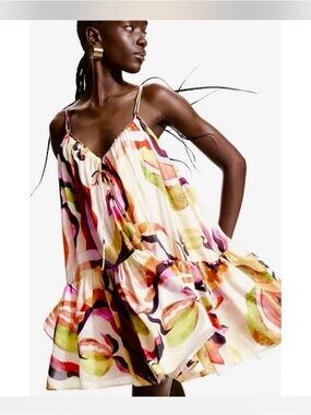 H&M A-line cream watercolor patterned strappy loose V-neck dress.